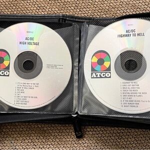 AC/DC High Voltage and Highway to Hell CDs